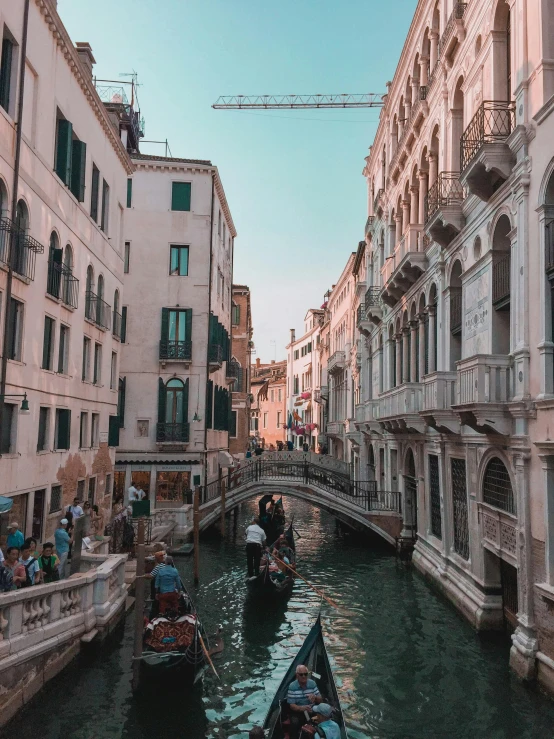 a canal filled with lots of boats next to tall buildings, a photo, pexels contest winner, renaissance, venice biennale's golden lion, thumbnail, shady alleys, calmly conversing 8k