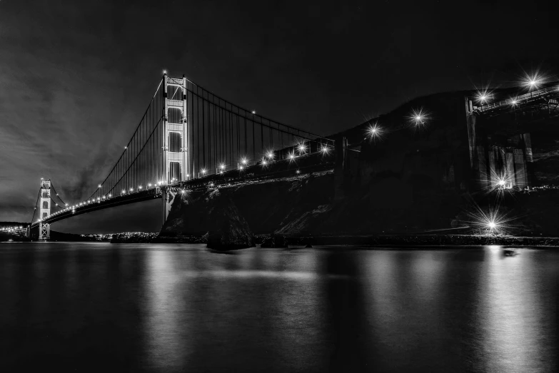 a black and white photo of the golden gate bridge, by Josh Bayer, pexels contest winner, night. by greg rutkowski, black and white artistic photo, desktop wallpaper, shiny golden
