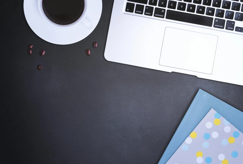 a laptop computer sitting on top of a desk next to a cup of coffee, pexels, computer art, 9 9 designs, black, background image, square