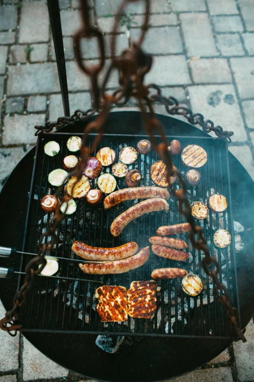 sausages and hot dogs cooking on a grill, by Jakob Emanuel Handmann, pexels, baroque, hanging, high view, metalwork, instagram story