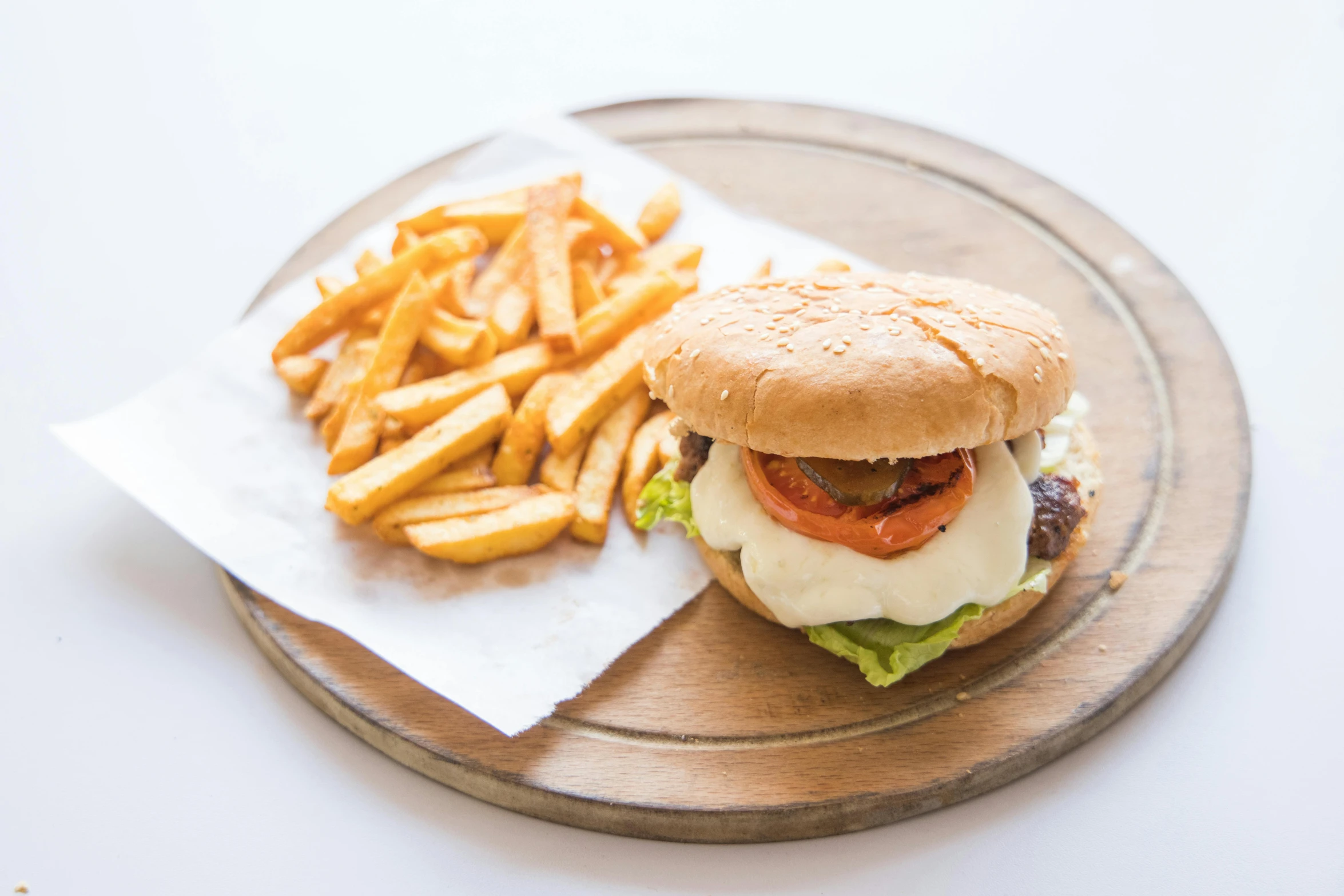 a burger and french fries on a plate, jen atkin, mozzarella, on a wooden plate, 15081959 21121991 01012000 4k