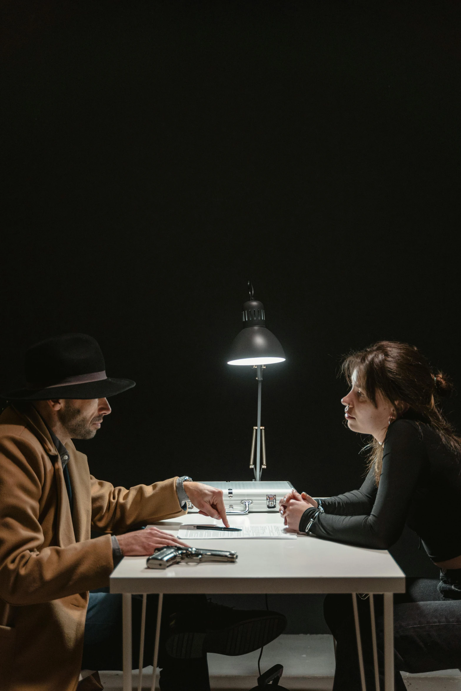 a man and a woman sitting at a table, poster art, pexels contest winner, detective thriller, concept photo, cowboy, in a meeting room