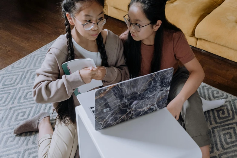 two girls sitting on the floor looking at a laptop, trending on pexels, asian descent, teaching, avatar image, thumbnail
