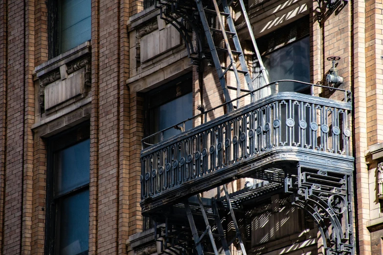 a clock that is on the side of a building, fire escapes, profile image, fan favorite, louis sullivan