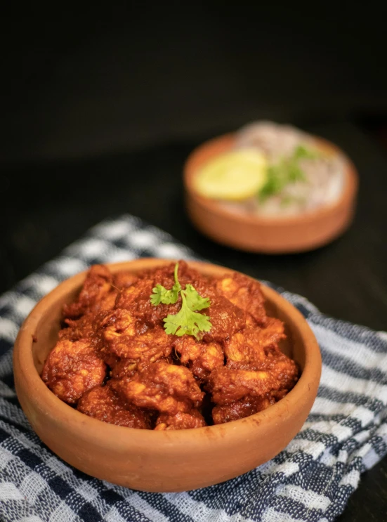 a close up of a bowl of food on a table, inspired by Jitish Kallat, high-quality photo, chicken, trending photo, angle view