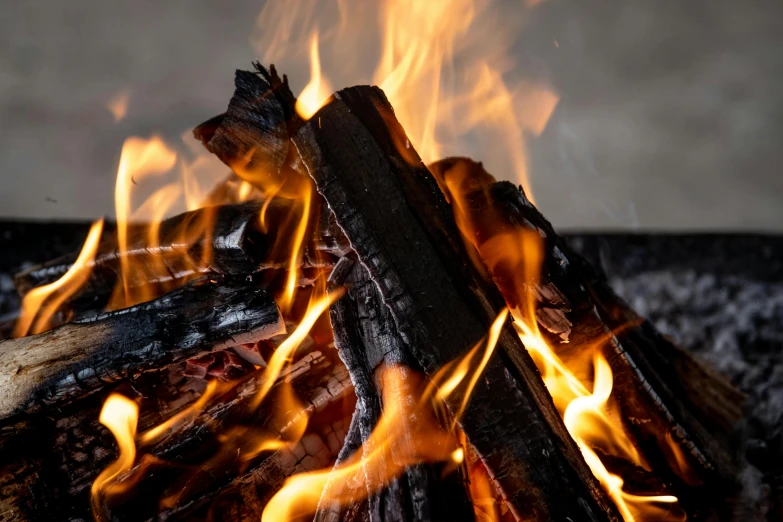 a pile of wood sitting on top of a fire pit, pexels contest winner, flames around body, avatar image, close up image, full product shot