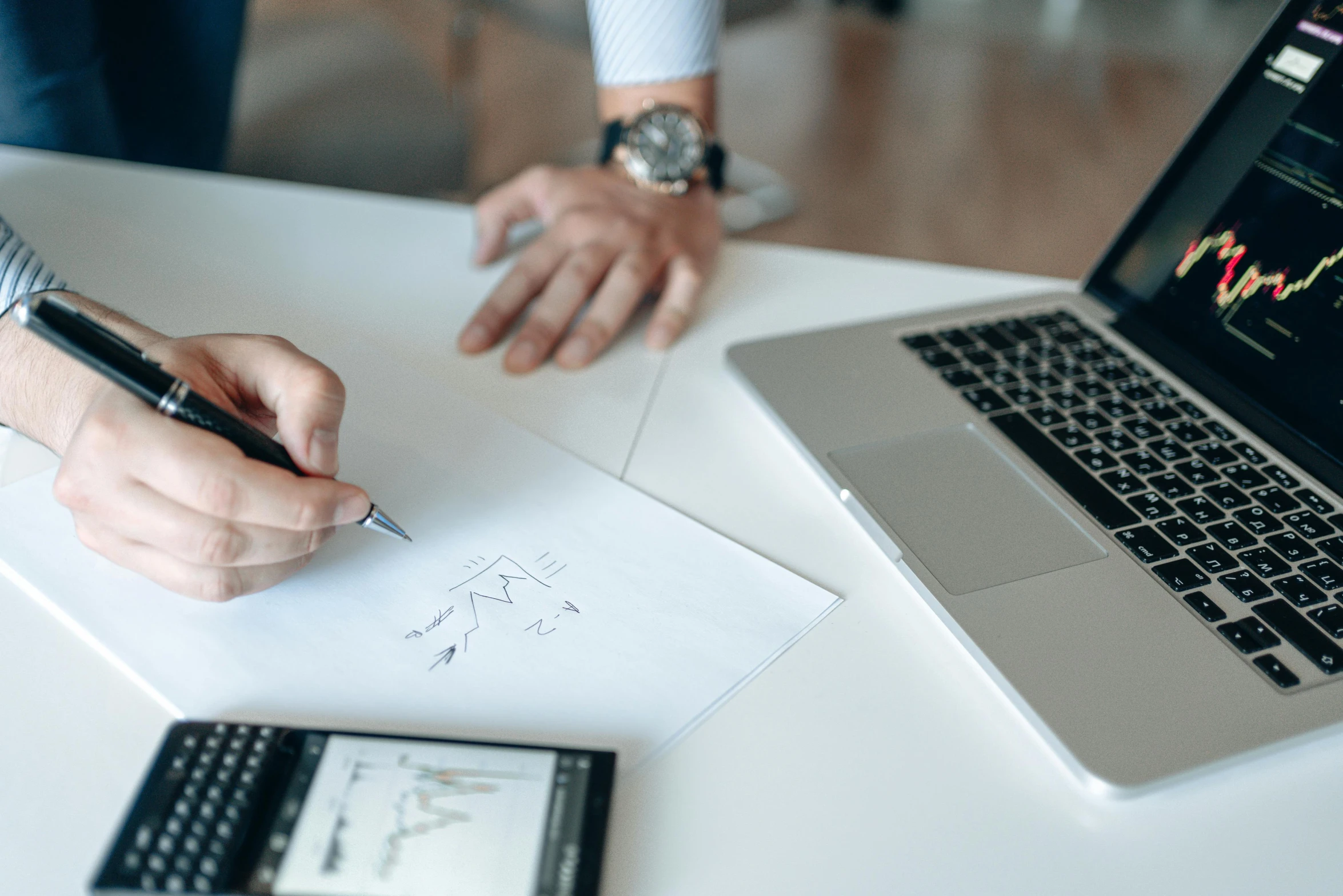 a person writing on a piece of paper next to a laptop, a drawing, by Adam Marczyński, trending on pexels, corporate business, standing on a desk, graphic templates, multiple stories