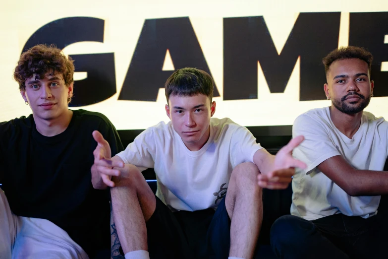 a group of young men sitting on top of a couch, an album cover, by Sam Black, unsplash, front cover of a new video game, grime, 3 actors on stage, pc gaming