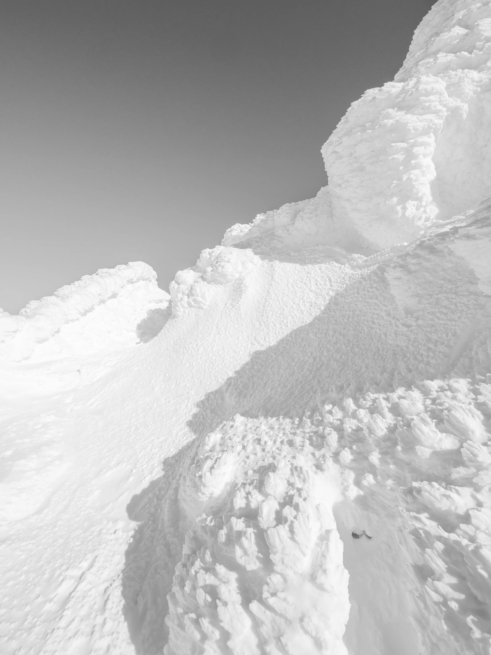 a man riding a snowboard down the side of a snow covered slope, an ambient occlusion render, by Matthias Weischer, trending on unsplash, process art, lots of white cotton, epic land formations, close-up!!!!!, stacked image