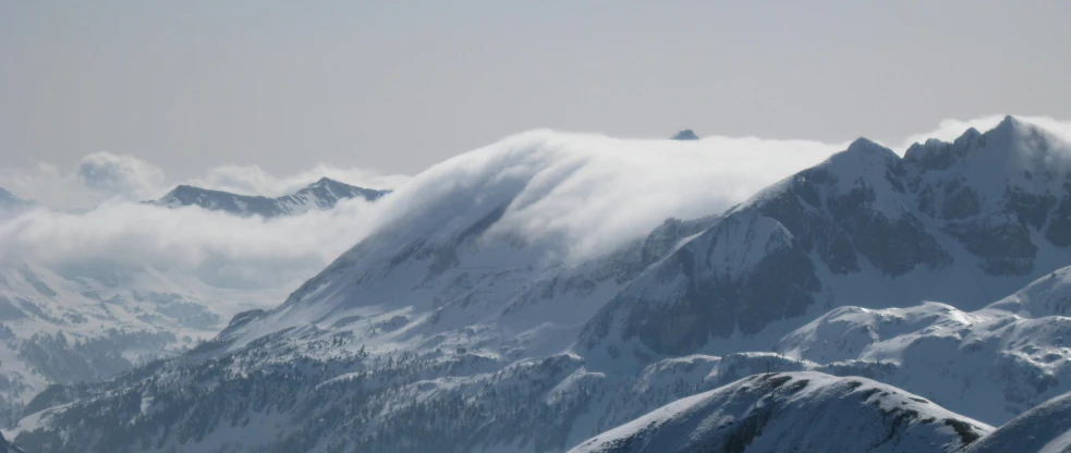 a group of people standing on top of a snow covered mountain, big smoke clouds visible, towering waves, carson ellis, whistler