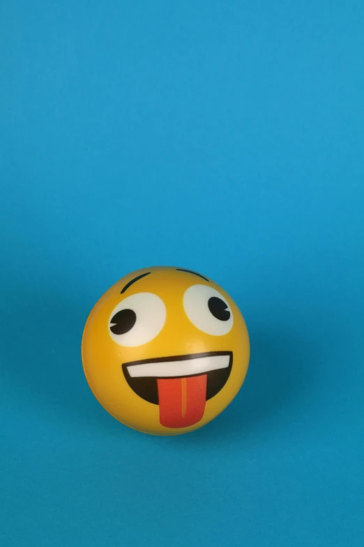 a yellow ball with a tongue sticking out of it, a picture, trending on reddit, ecstatic face expression, toy photo, brown, gif