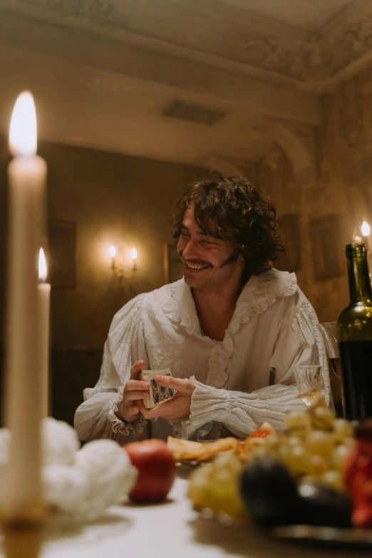 a man sitting at a table with a glass of wine, inspired by Jean-Antoine Watteau, pexels contest winner, renaissance, henry cavill, robert sheehan, indoor scene, [ theatrical ]
