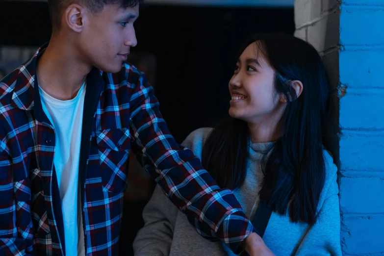 a man and a woman standing next to each other, trending on pexels, happening, young asian girl, teenage boy, smiling at each other, ( ( theatrical ) )