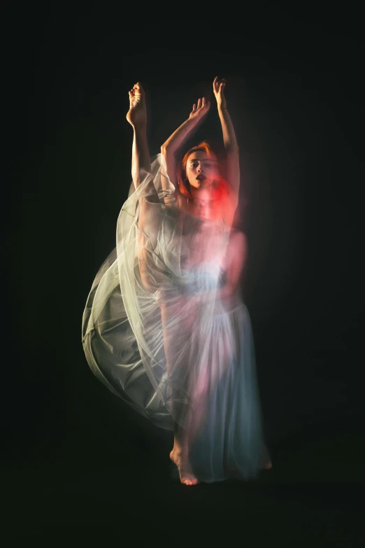 a woman in a white dress is dancing, by David Martin, art photography, vivid studio light, draped in transparent cloth, soft grey and red natural light, glowing with colored light