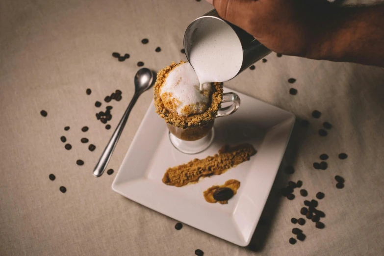 a white plate topped with a cup of coffee, inspired by François Bocion, gif, ice cream on the side, pouring, high quality product image”