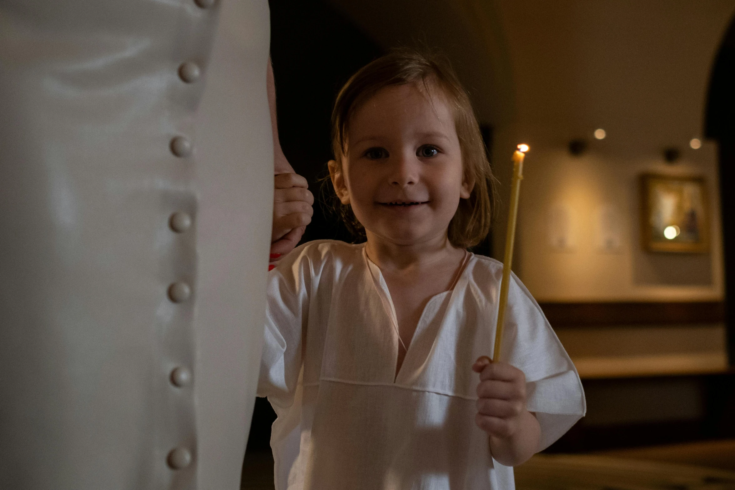 a little girl holding a toothbrush in her hand, inspired by Louis Le Nain, candlelight, standing in front of the altar, in medieval armoury, annato finnstark