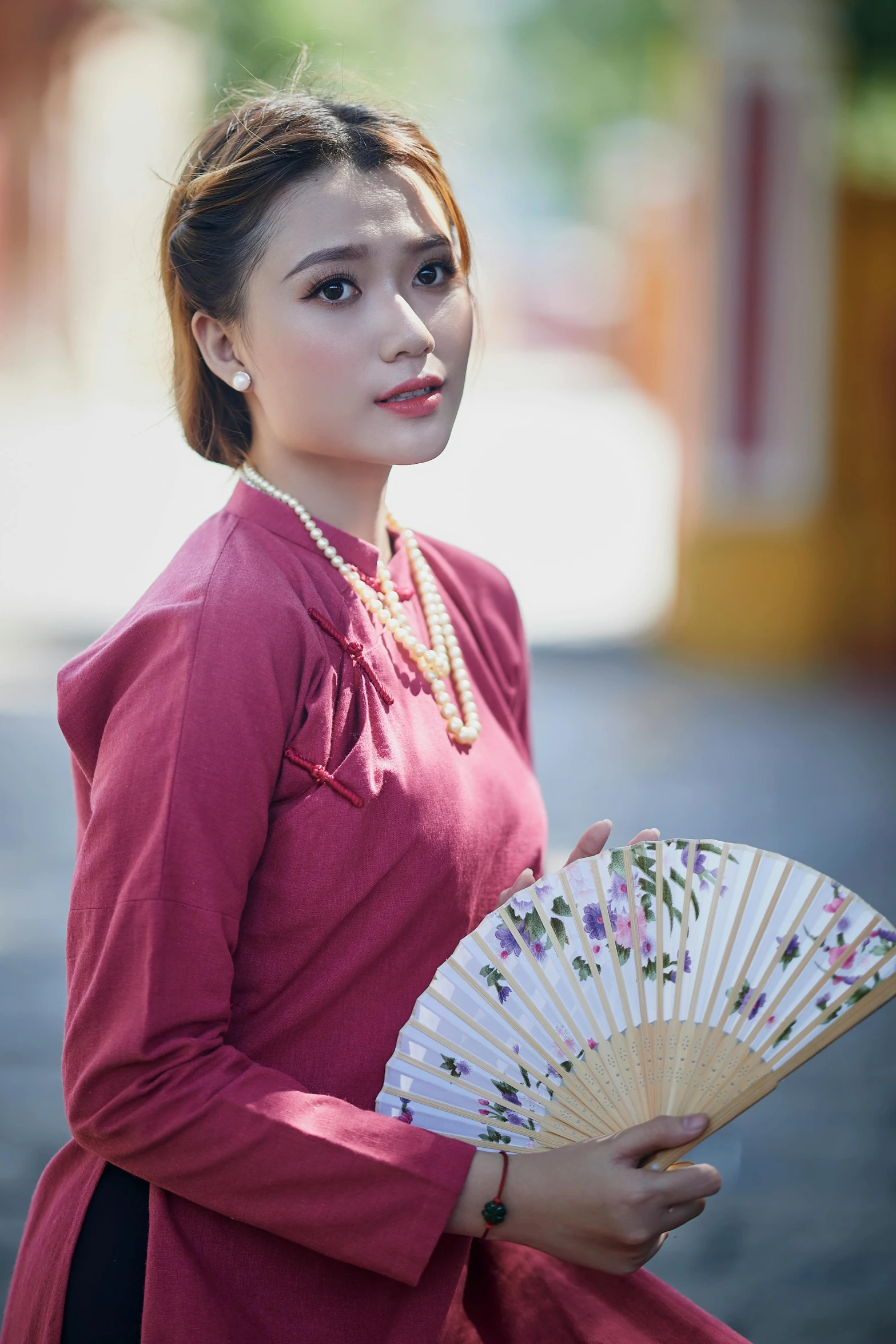 a woman in a red dress holding a fan, inspired by Lan Ying, pexels contest winner, wearing a blouse, square, vietnam, retro style ”