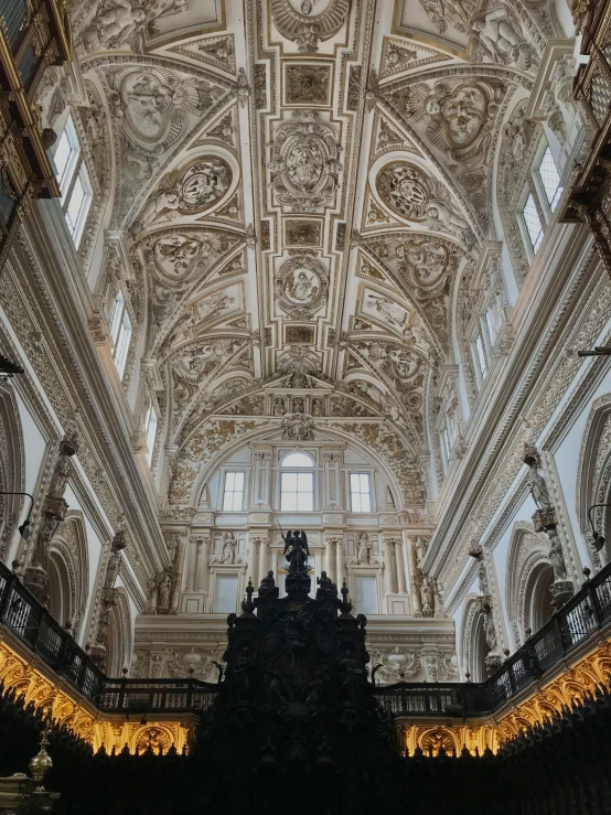 the ceiling of a building with a clock on it, an album cover, by Diego Velázquez, unsplash contest winner, baroque, in a large cathedral, 2 5 6 x 2 5 6 pixels, photo taken from a boat, moorish architecture