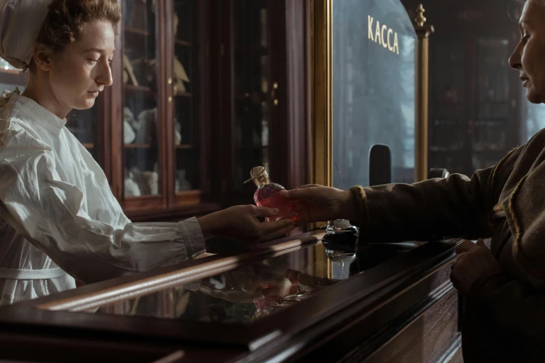 a man standing next to a woman at a bar, a portrait, by Emma Andijewska, pexels contest winner, rococo, carrying a bottle of perfume, saoirse ronan, hands on counter, framestore