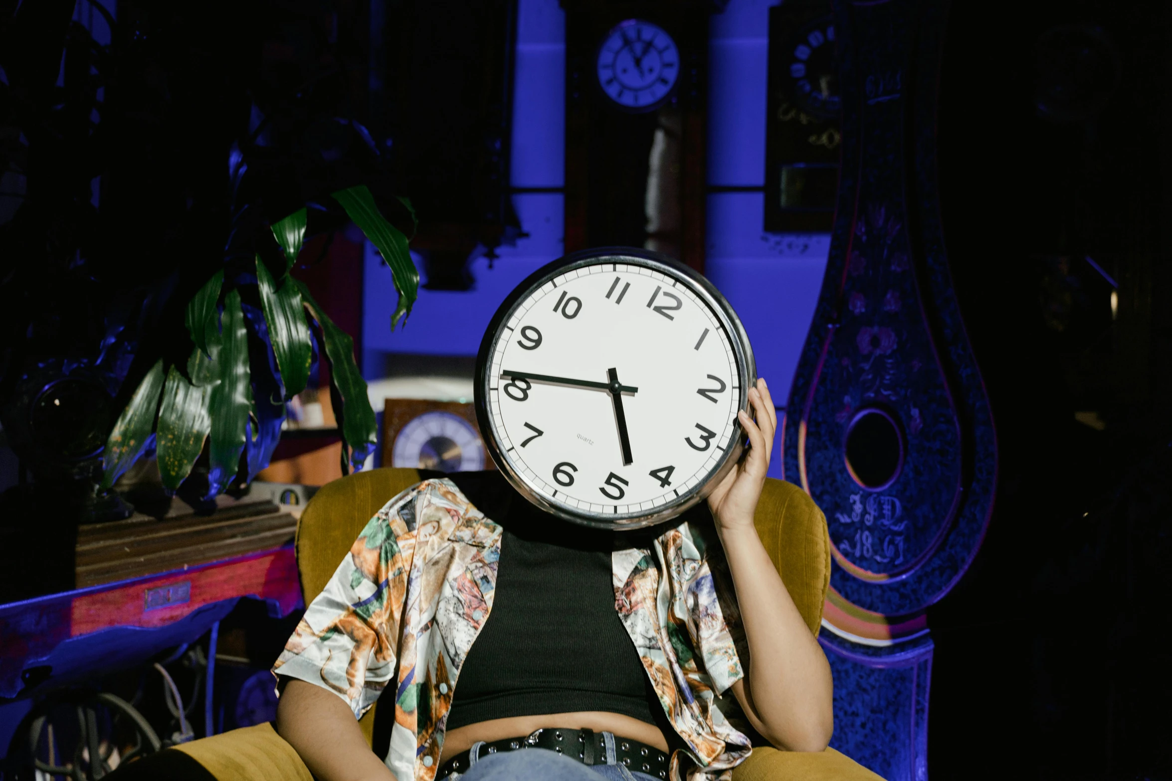 a woman sitting in a chair with a clock on her head, trending on pexels, maximalism, late night, h3h3, slightly tanned, thumbnail