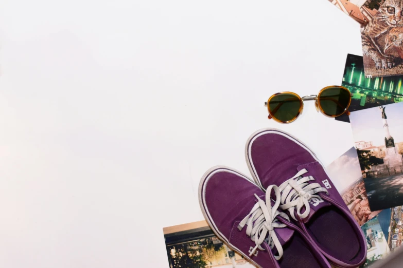 a pair of purple shoes sitting on top of a table, pexels contest winner, visual art, sunglasses, touring, with a white background, suns