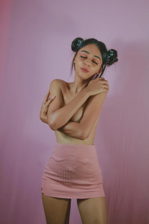 a woman in a pink skirt posing for a picture, an album cover, inspired by Elsa Bleda, trending on pexels, hyperrealism, breasts covered and sfw, 🤤 girl portrait, pigtail, she has olive brown skin