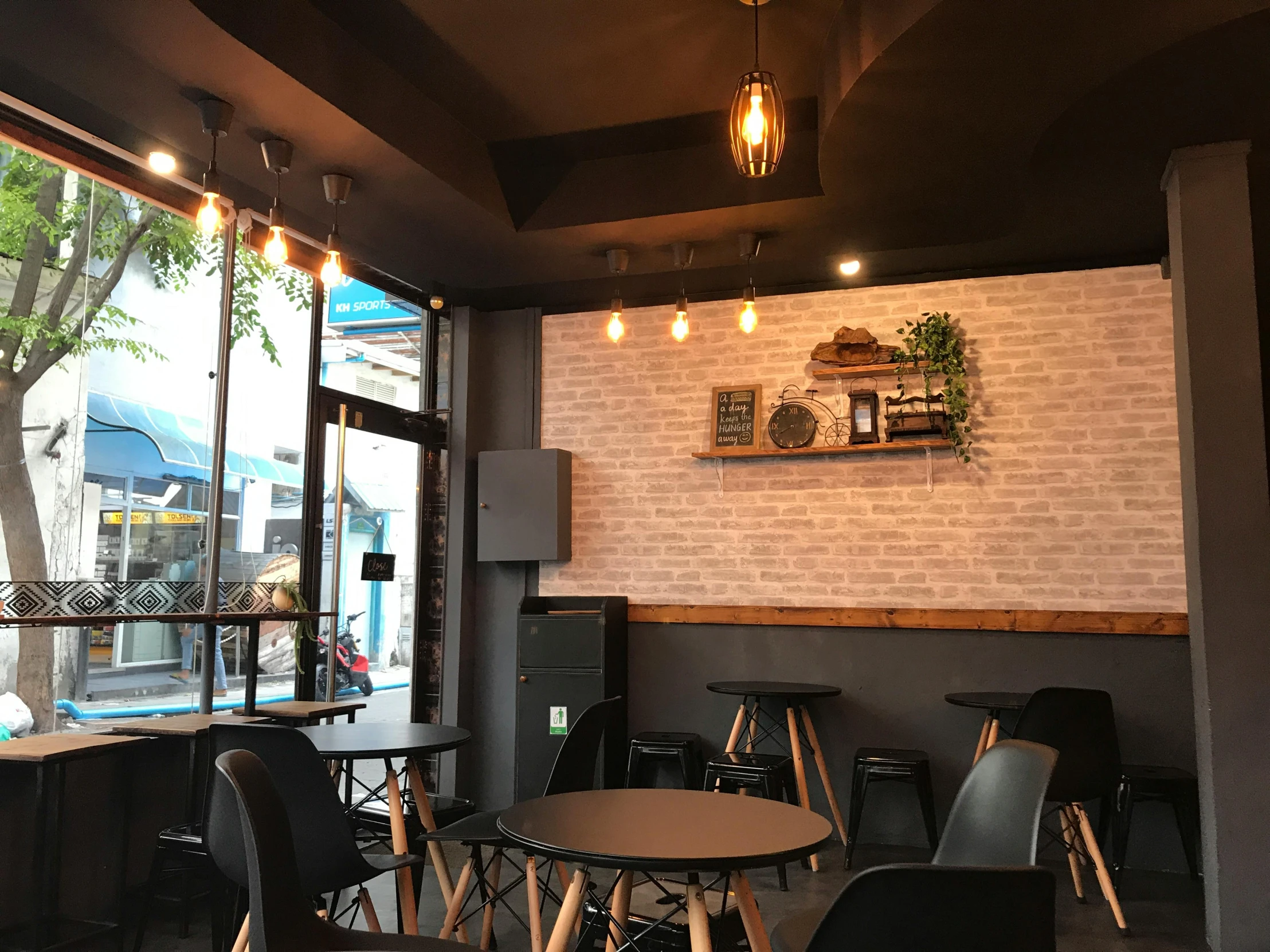 a room filled with tables and chairs next to a window, bao phan, profile image, coffee shop, esthetic photo