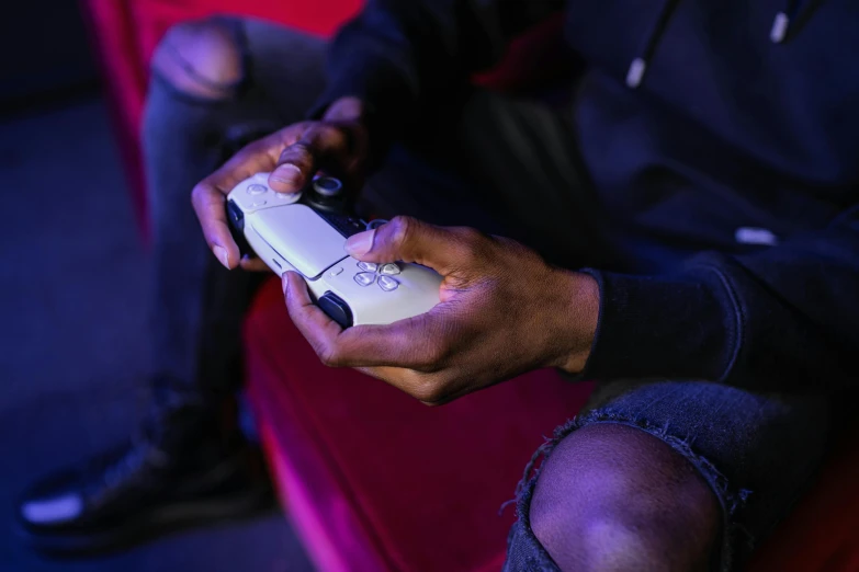 a close up of a person holding a video game controller, unsplash, afrofuturism, style game square enix life, on ps5, full length shot, mid night