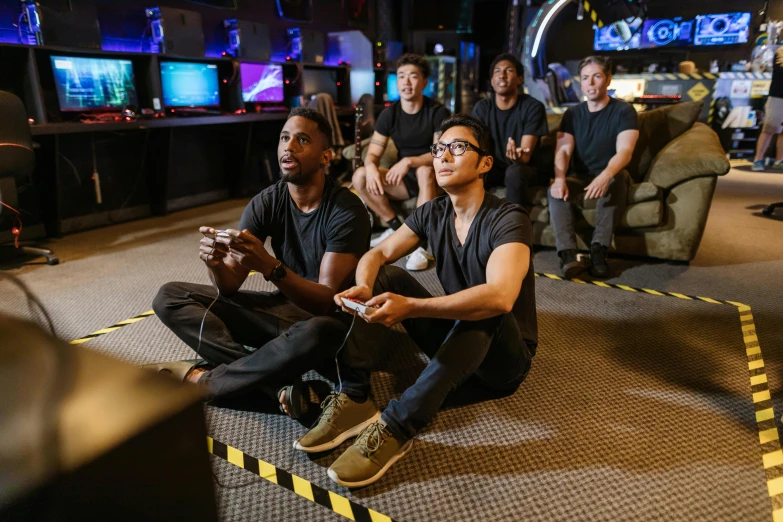 a group of people playing a video game, lee madgwick & liam wong, black, men, commercially ready