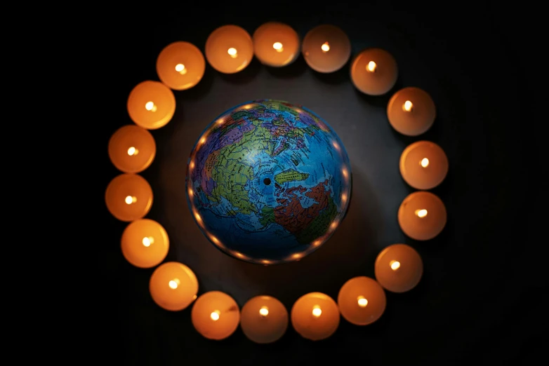 a globe surrounded by candles in a circle, by Alison Geissler, pexels, digital art, 15081959 21121991 01012000 4k, instagram post, credit nasa, lantern candle