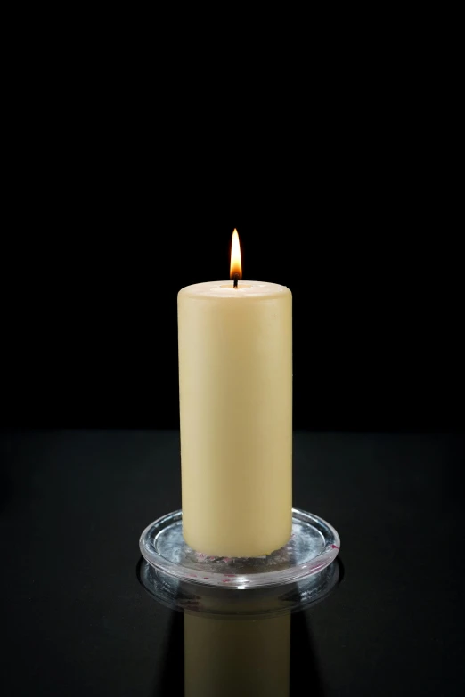 a lit candle sitting on top of a glass plate, kevlar, full product shot, 1 0 5 mm, pillar