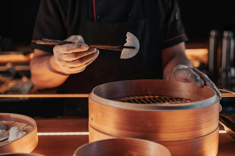 a close up of a person holding chopsticks over a bowl of food, cooking, inside a grand, profile image, construction