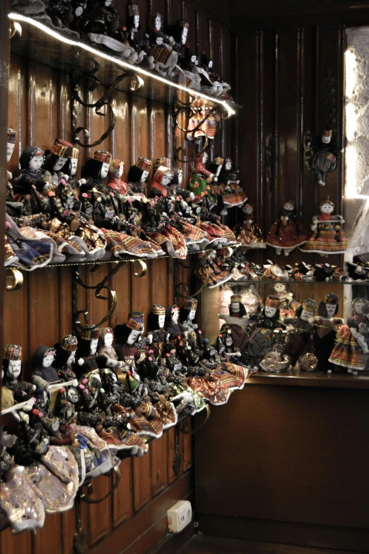 a room filled with lots of different types of toys, jester shoes, black and terracotta, venice, slide show