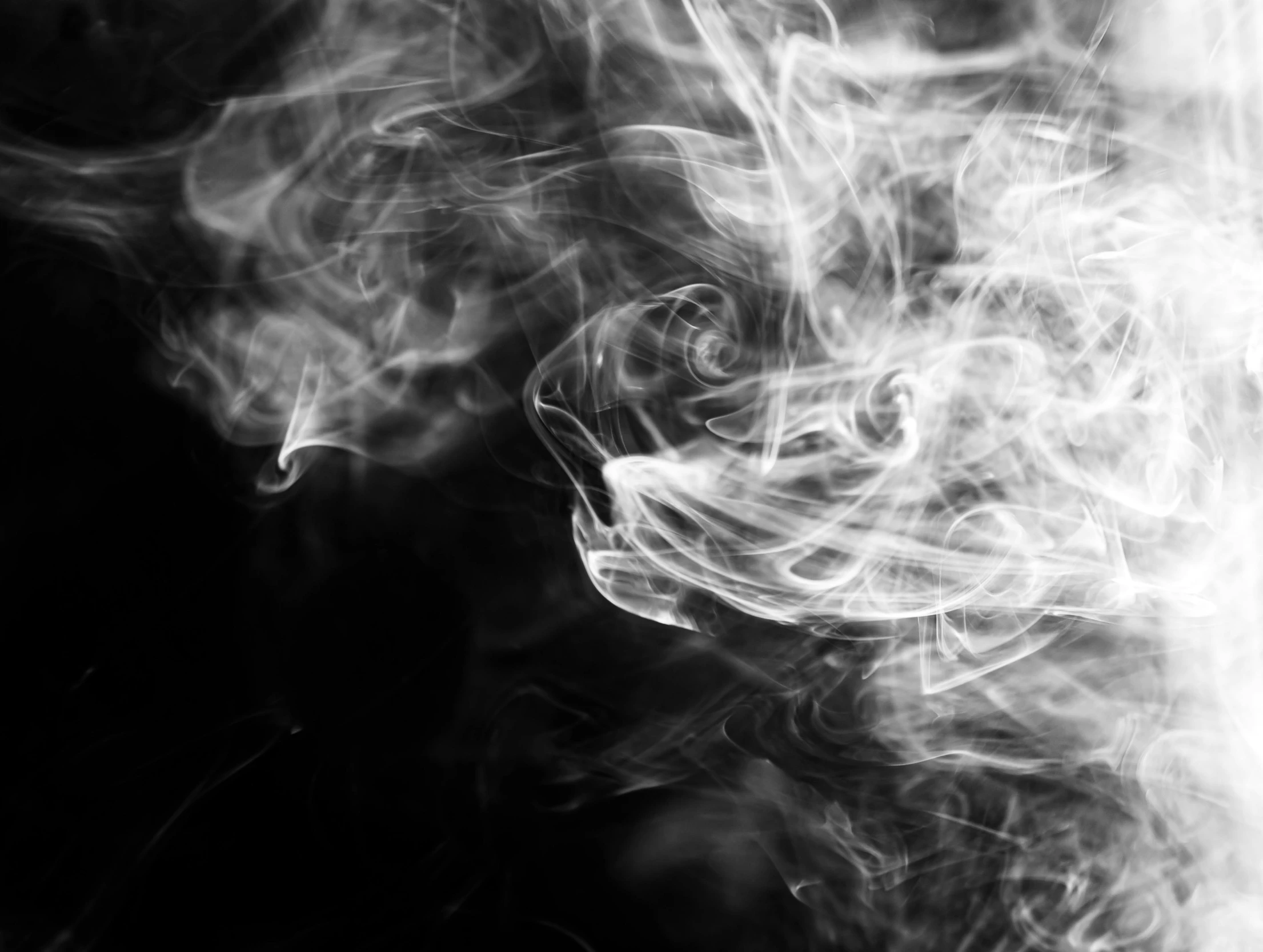 a close up of smoke on a black background, a black and white photo, by Kristian Zahrtmann, pixabay, istock, stylized illustration, fumes, wisps