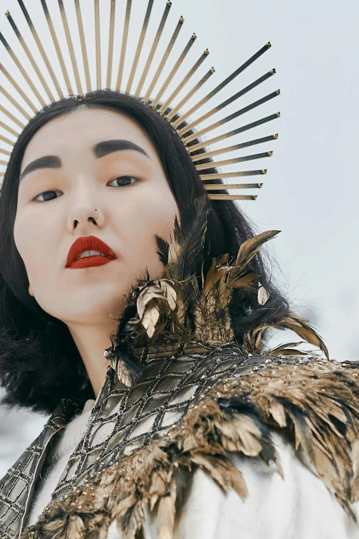 a woman with a crown on top of her head, inspired by Jin Nong, trending on pexels, baroque, wearing futuristic clothing, inuit heritage, asian man, pale ivory skin