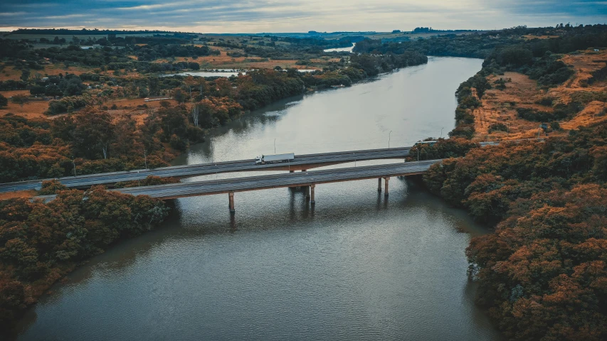 an aerial view of a bridge over a river, by Adam Marczyński, pexels contest winner, river in the background, lachlan bailey, ultrawide landscape, unedited