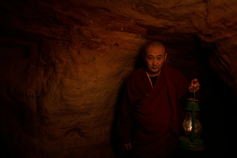a man standing in a cave holding a lantern, a portrait, unsplash contest winner, shin hanga, maroon, songlines, tabaxi monk, slide show