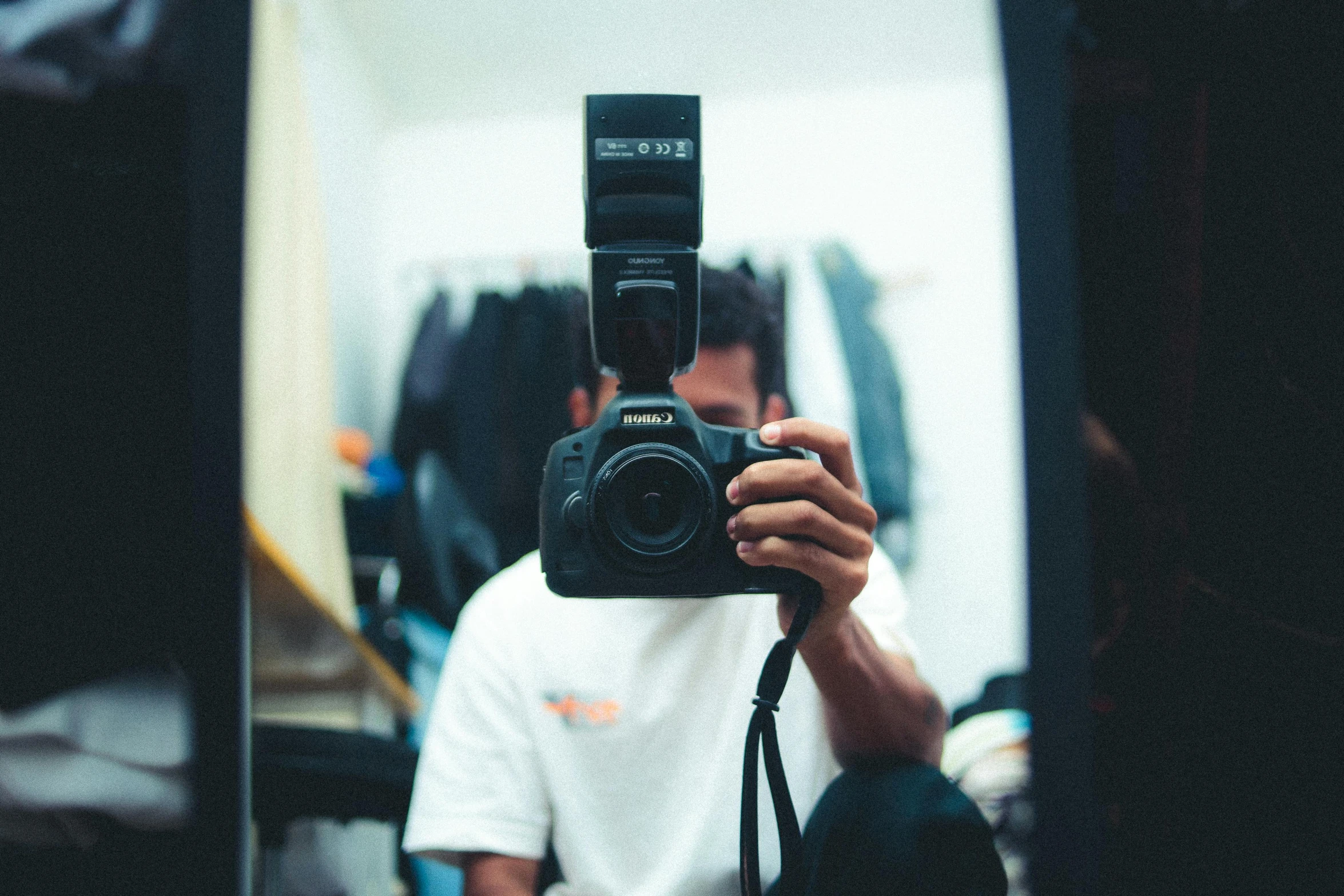 a man taking a picture of himself in a mirror, pexels contest winner, trending on r/streetwear, camera from a low angle, front flash, headshot