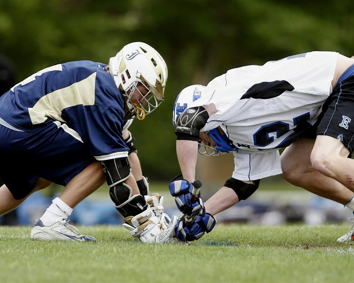 a group of men playing a game of lacrosse, by Paul Davis, shutterstock, white + blue + gold + black, helmet, covering the ground, college
