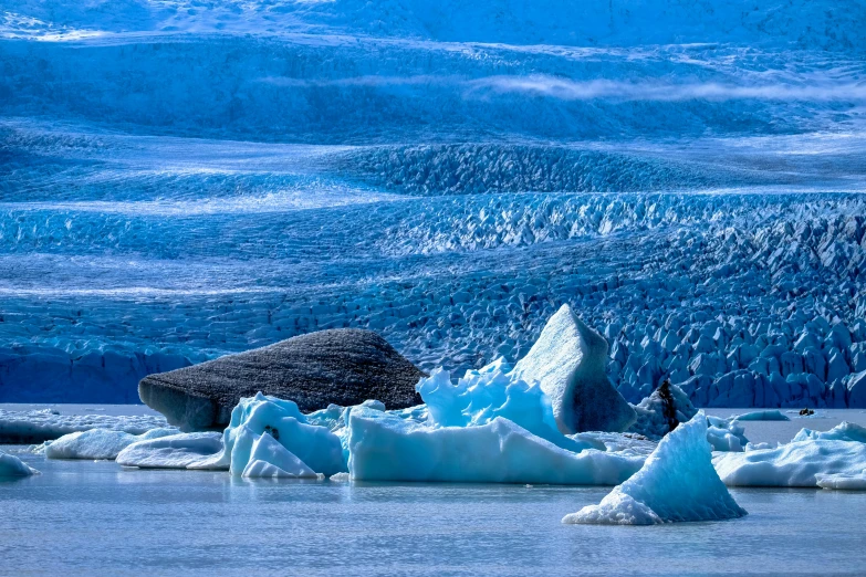 a group of penguins sitting on top of icebergs, by Julia Pishtar, pexels contest winner, blue glacier volcano eruption, tones of blue and green, thumbnail, frozen lake