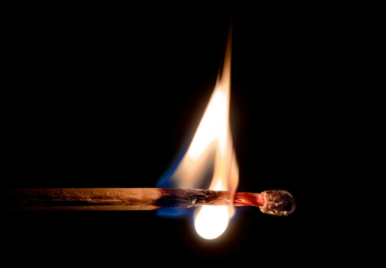 a close up of a lit match on a black background, by Jan Rustem, fan favorite, journalism photo, profile image, hot glue