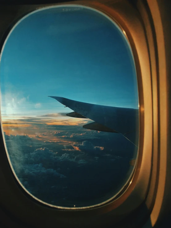 a view of the sky through an airplane window, pexels contest winner, lofi aesthetic, world seen only through a portal, end of the day, travel guide