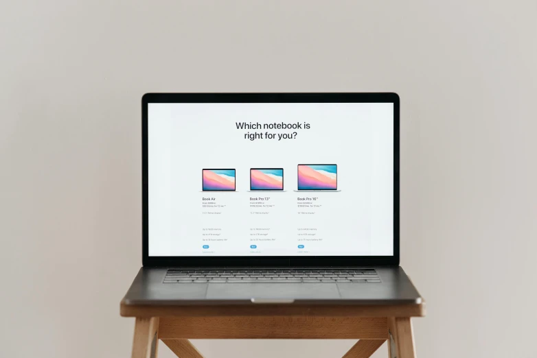 a laptop computer sitting on top of a wooden table, by Carey Morris, unsplash, pink and blue gradients, set against a white background, product showcase, do you want to know