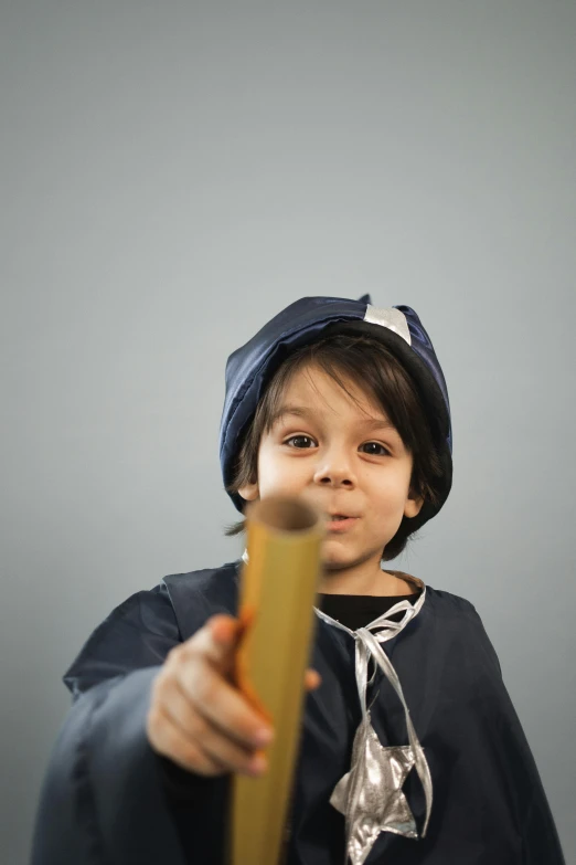 a little boy that is holding a bat, an album cover, pexels contest winner, wearing a french beret, holding a wood piece, postprocessed), holding pencil