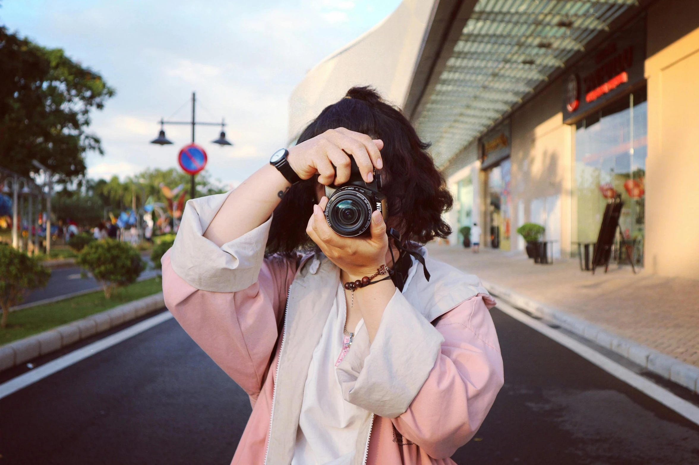 a woman taking a picture with a camera, inspired by Vivian Maier, pexels contest winner, ulzzang, ((sharp focus)), low colour, over-the-shoulder-shot