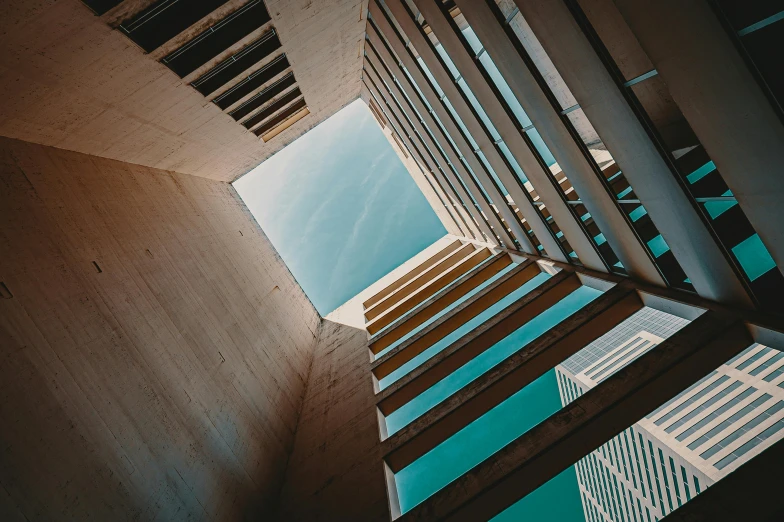 a very tall building with a lot of windows, an album cover, inspired by Ricardo Bofill, pexels contest winner, light and space, square lines, view from ground, wooden buildings, unsplash 4k