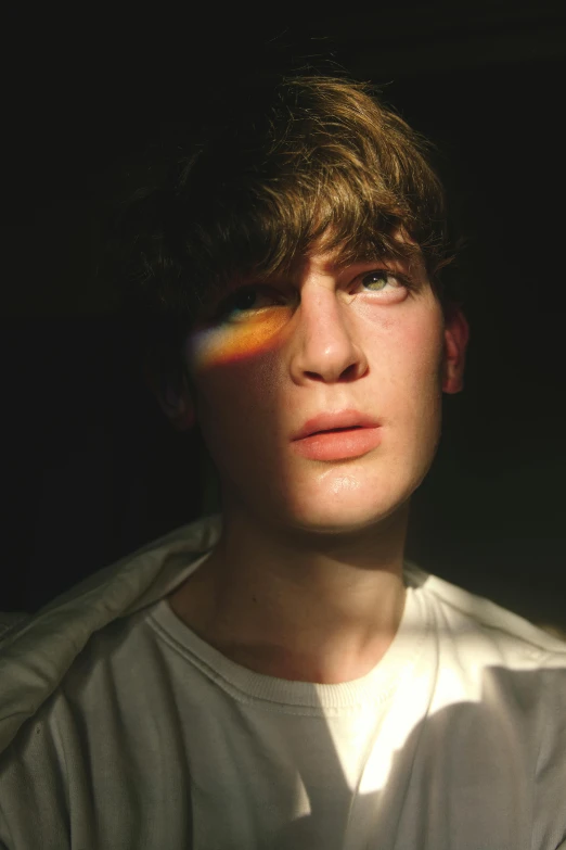 a close up of a person wearing a white shirt, an album cover, trending on pexels, hyperrealism, rainbow eyes, teenage boy, blinking lights, twink