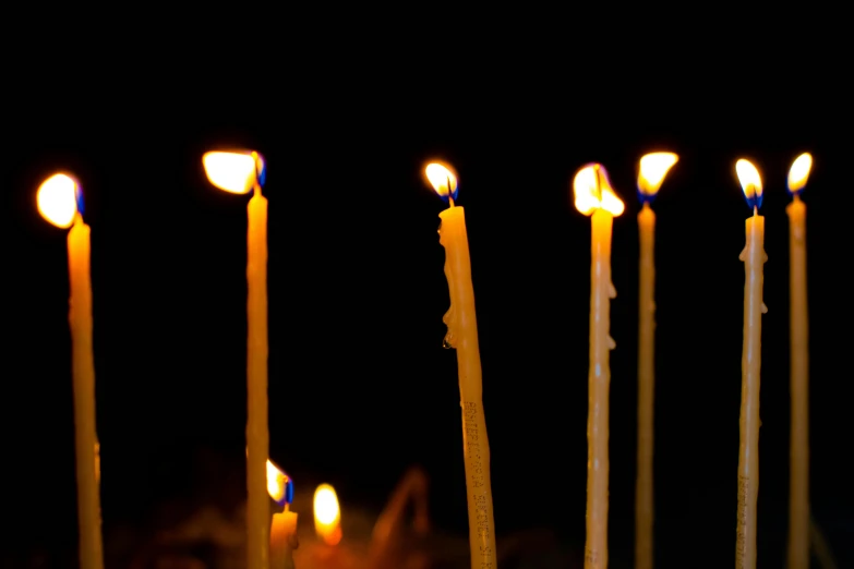 a group of lit candles sitting on top of a table, an album cover, by Jan Rustem, unsplash, avatar image