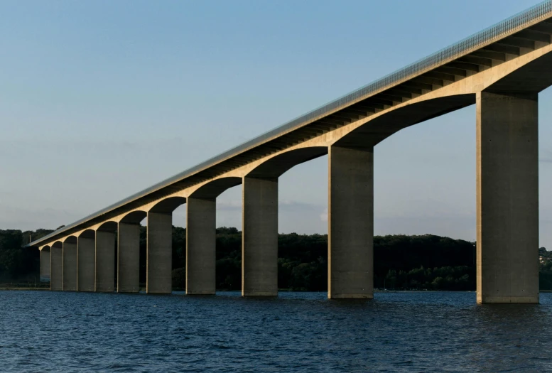 a long bridge over a large body of water, an album cover, inspired by Tadao Ando, pexels contest winner, renaissance, aqueducts, rhode island, infrastructure, cornell