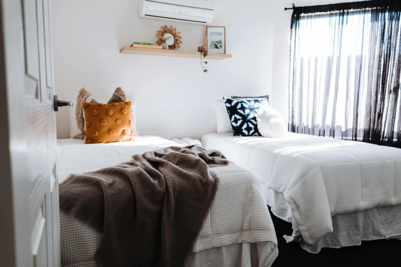 a couple of beds sitting next to each other, unsplash, manuka, browns and whites, brightly-lit, comfort posse